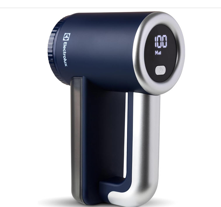 Fabric shaver being used to remove pilling from a sweater
