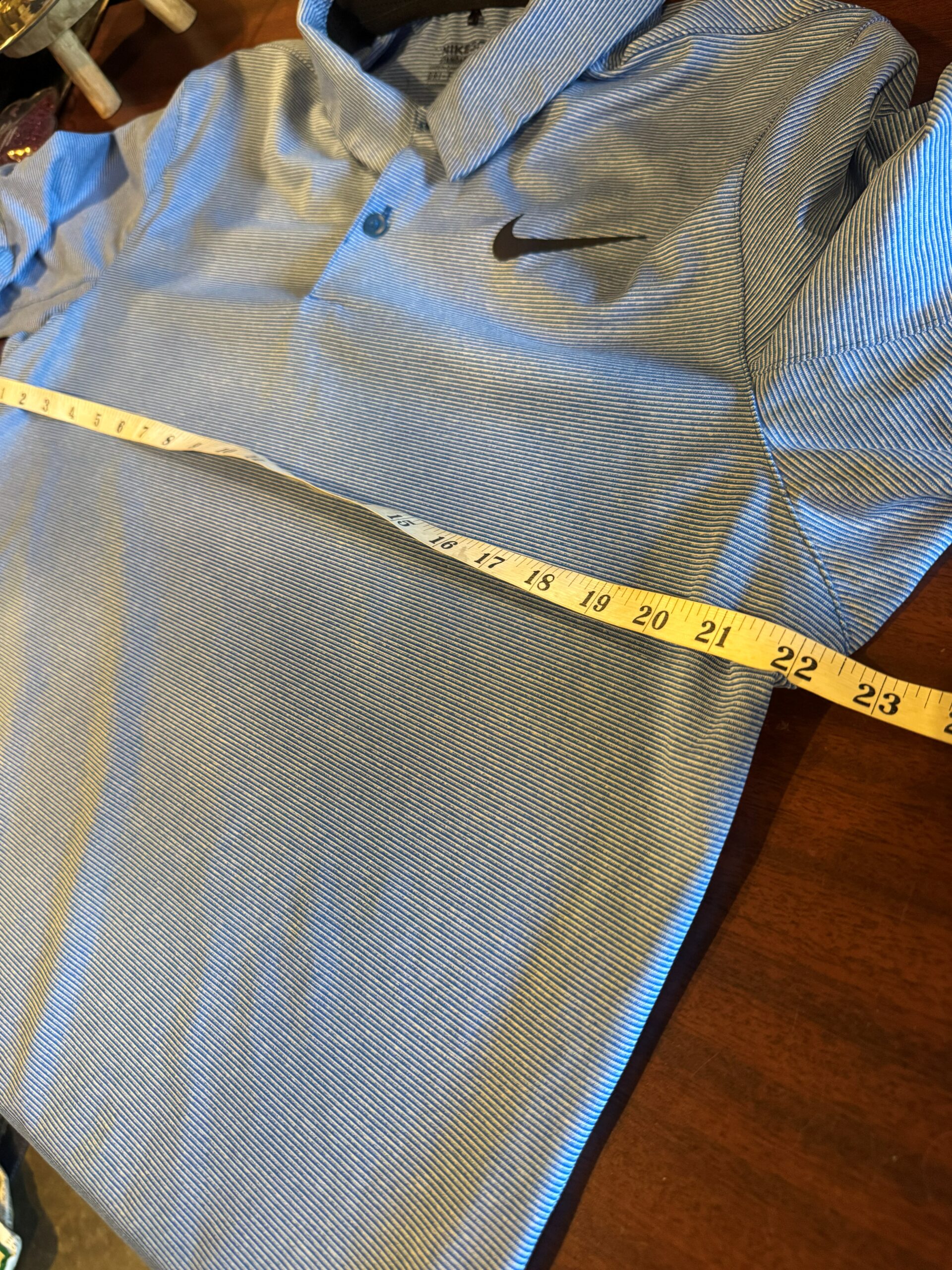 Measuring the pit to pit width of a shirt for an online clothing listing