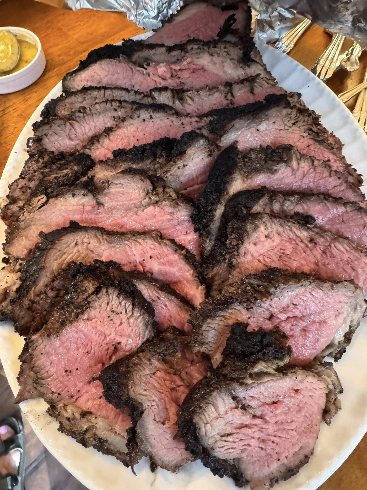 Sliced coffee-rubbed tri-tip served with bourbon mushroom cream sauce