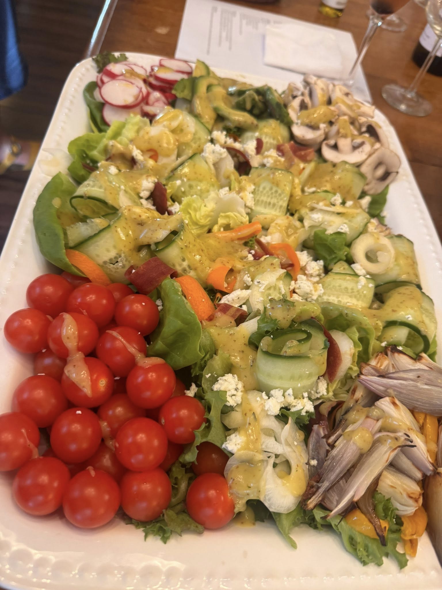 Green salad served with truffle white wine vinaigrette